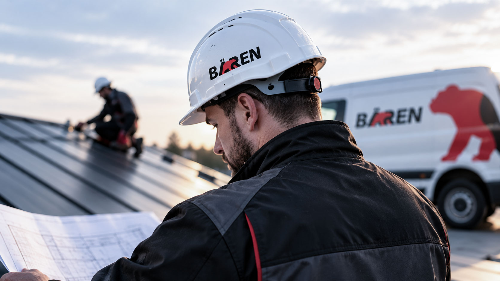 Bären Baugruppe AG roofer in a white hard hat with the logo, reading plans beside a company van with the red bear