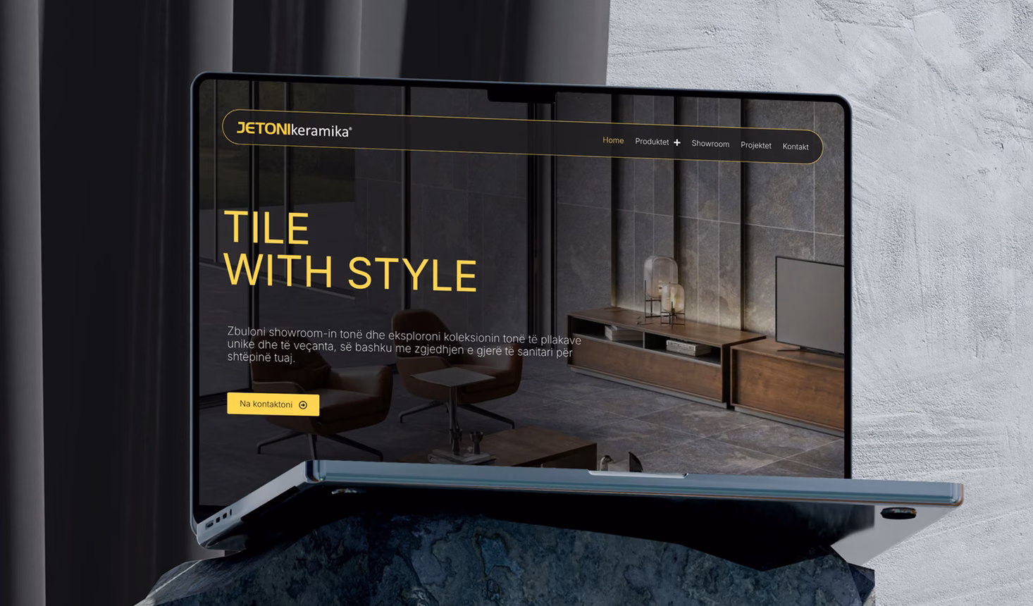 Jetonikeramika website on a laptop: the dark homepage opening with the headline “Tile with style”